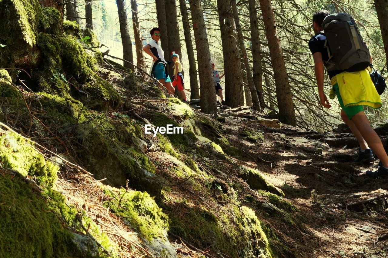 WOMAN WALKING IN FOREST