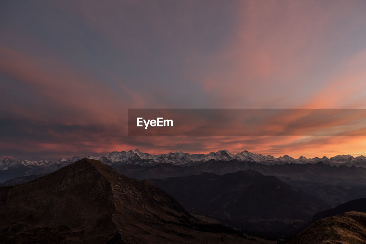 Scenic view of mountains against sky during sunset