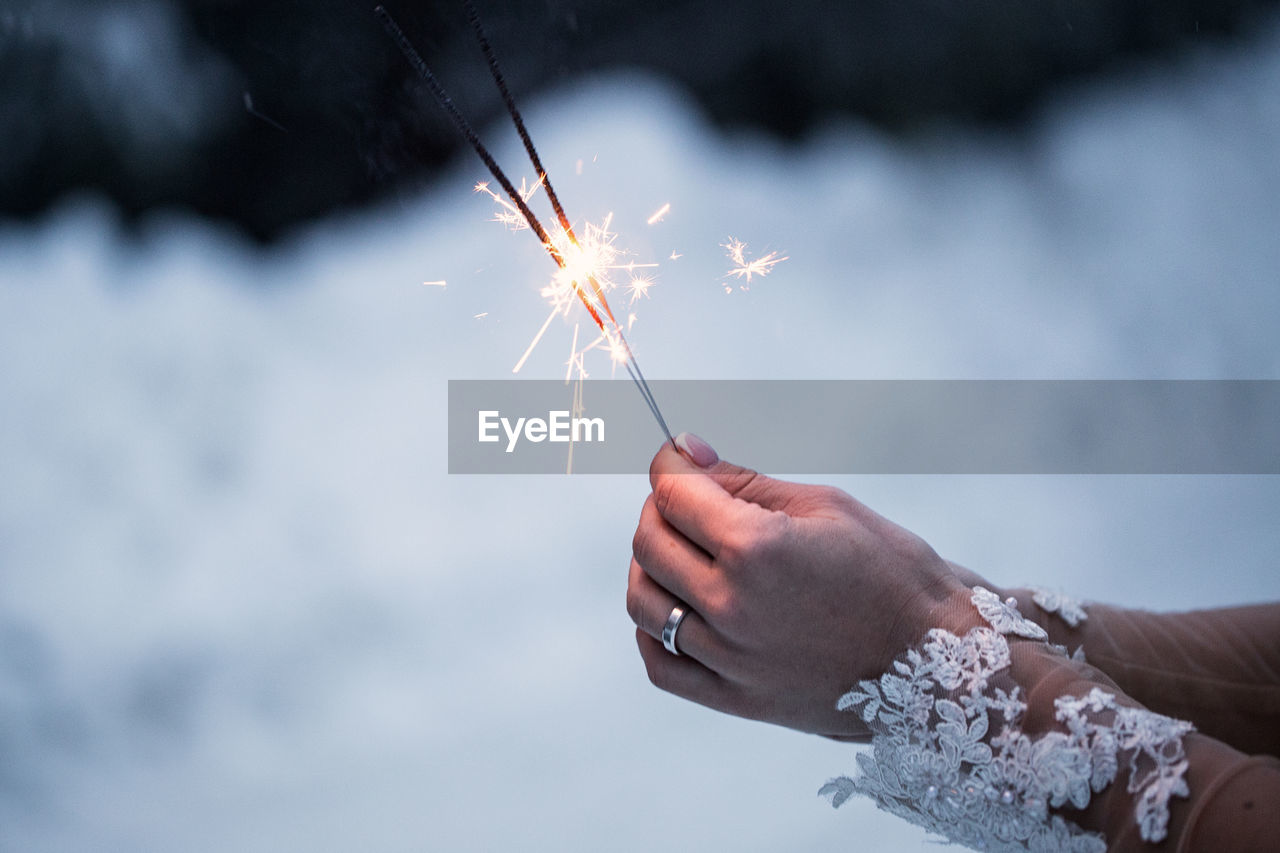 Woman holding sparklers