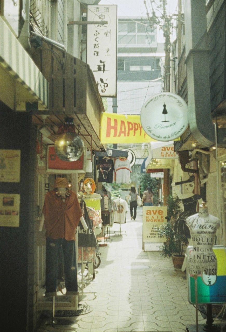 PEOPLE STANDING ON STREET MARKET