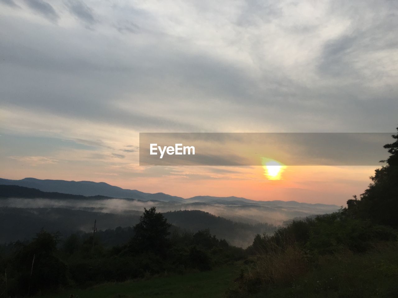 SCENIC VIEW OF MOUNTAINS DURING SUNSET