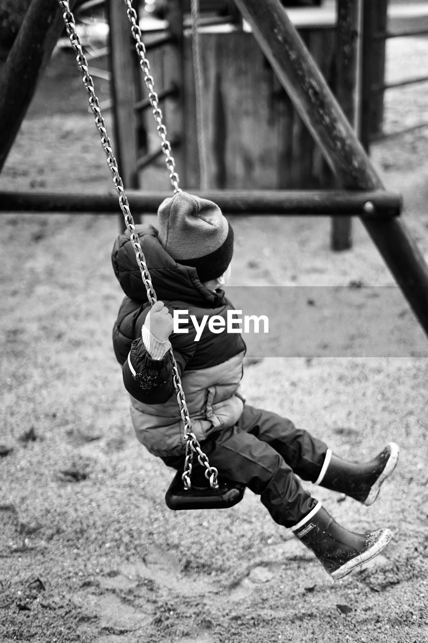 Boy on swing at playground