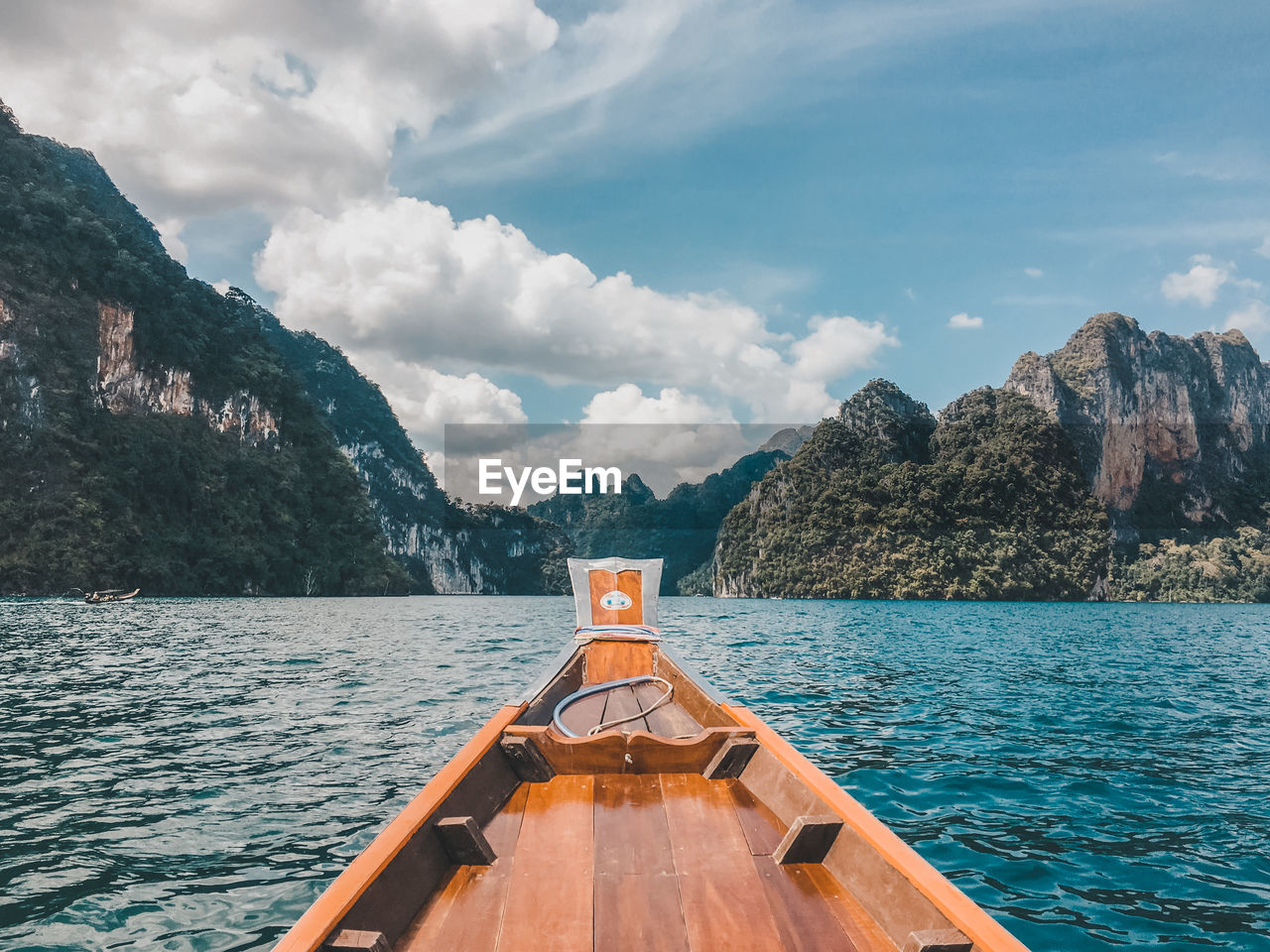 Scenic view of sea and mountains against sky
