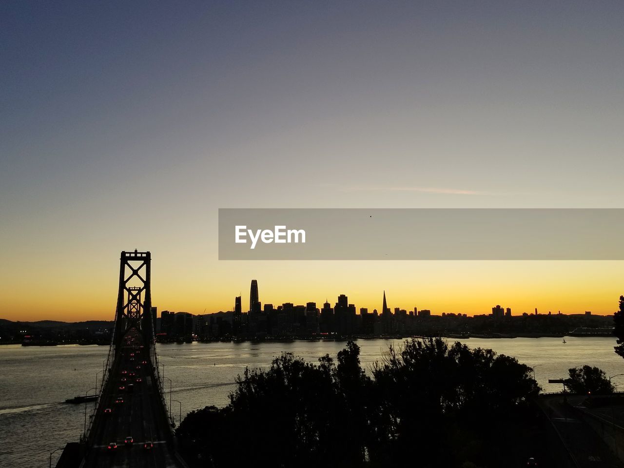 SILHOUETTE OF CITY AGAINST CLEAR SKY