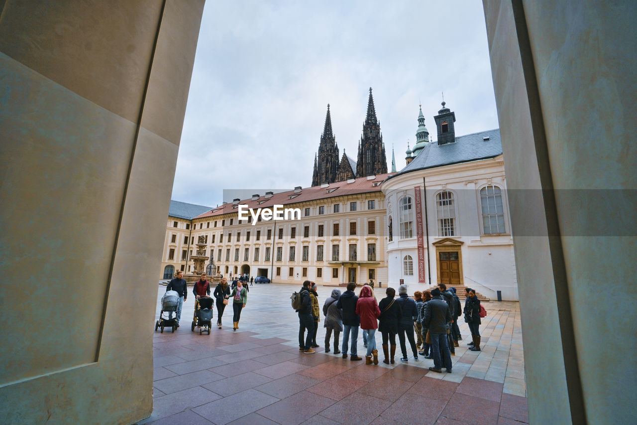 GROUP OF PEOPLE IN HISTORIC BUILDING