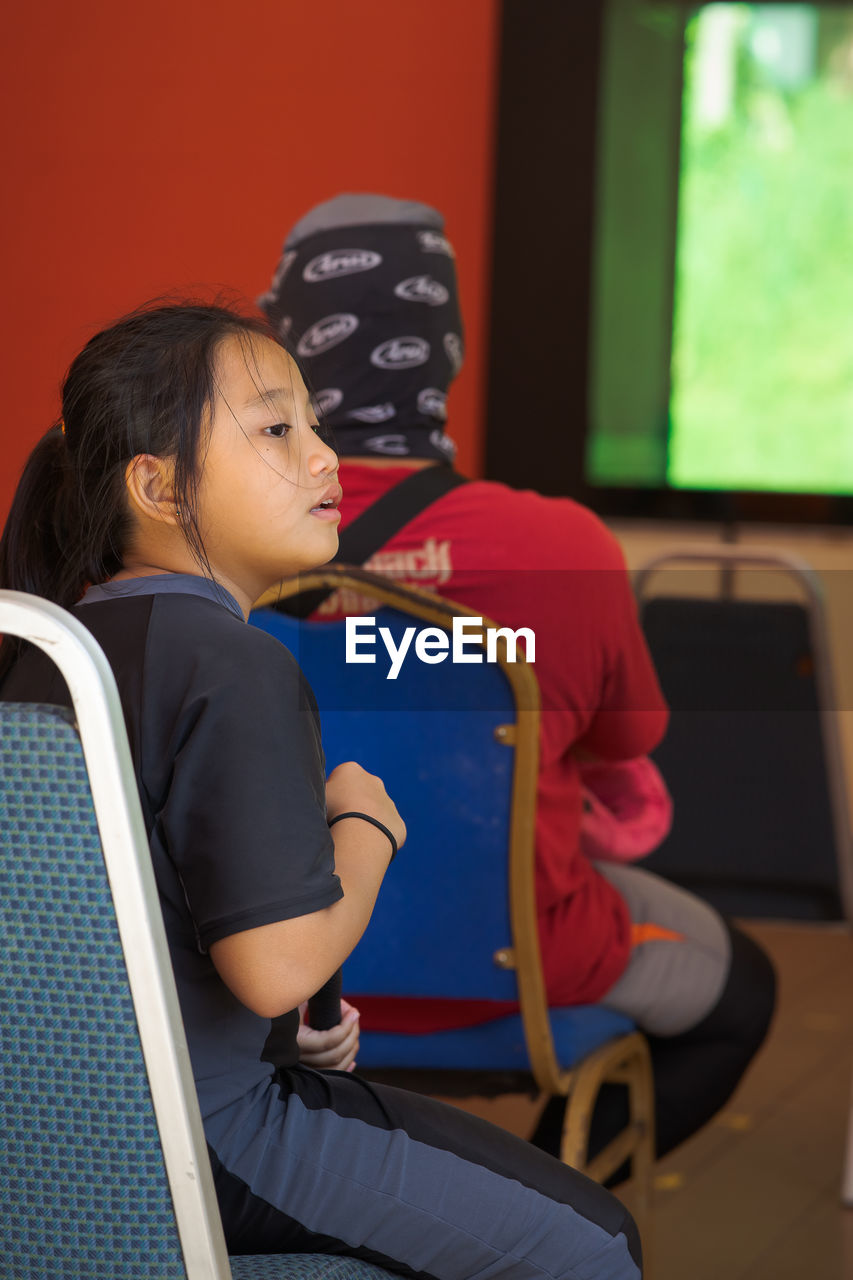 Cute girl sitting at classroom