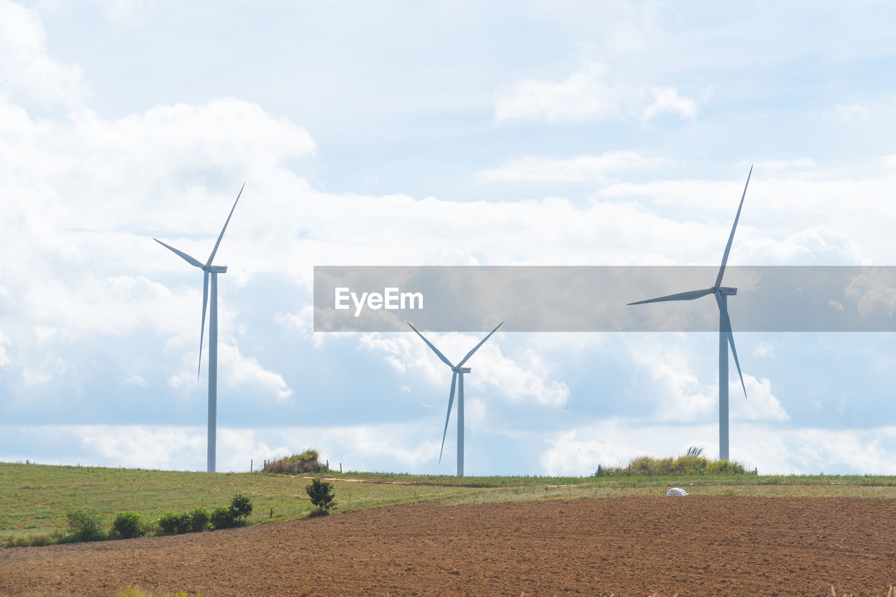 WIND TURBINES ON FIELD