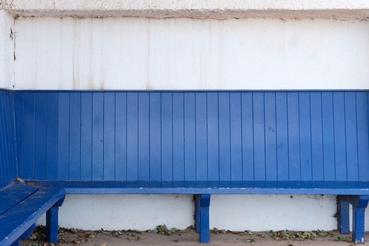 Blue bench in beachside shelter at spittal beach, northumberland, england