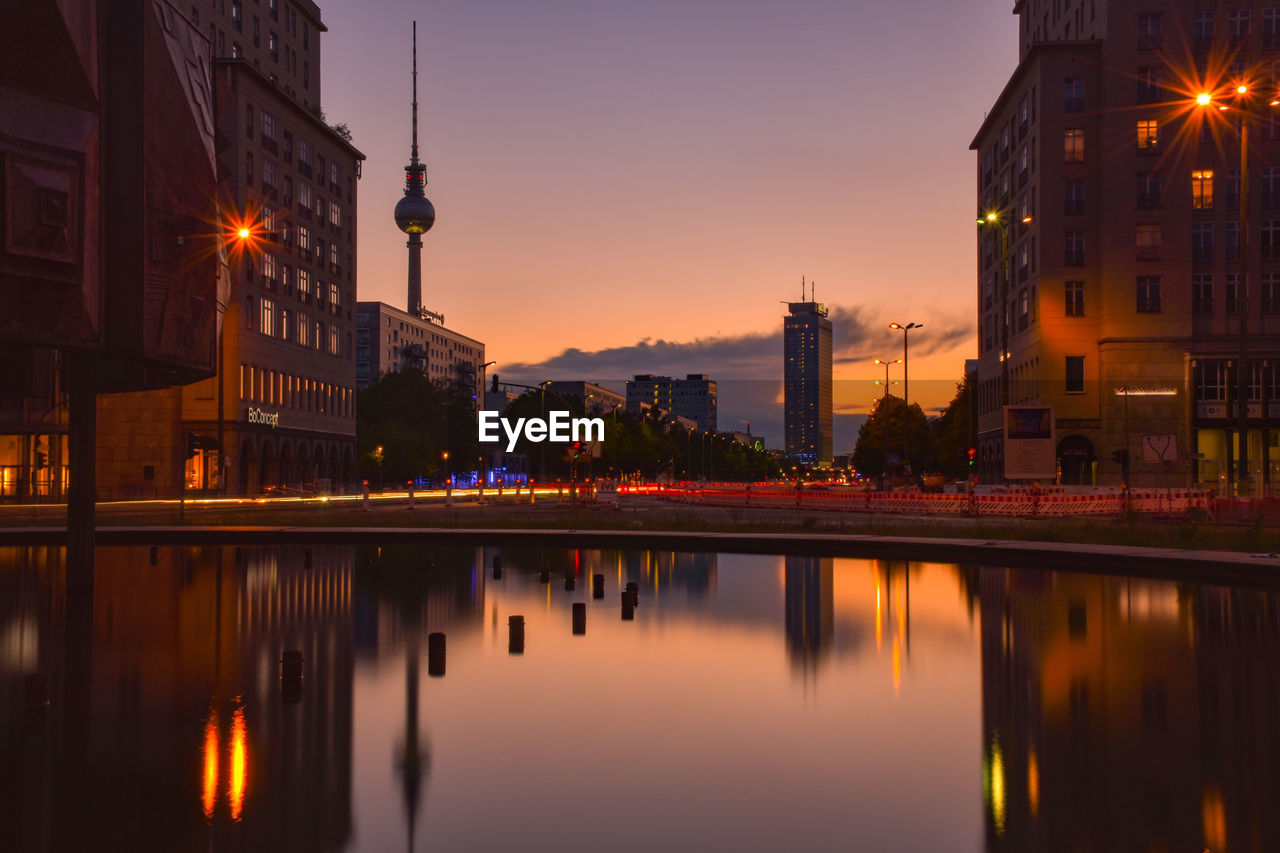 Reflection of buildings in city at night