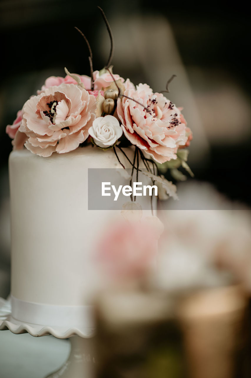 Close-up of roses on cake