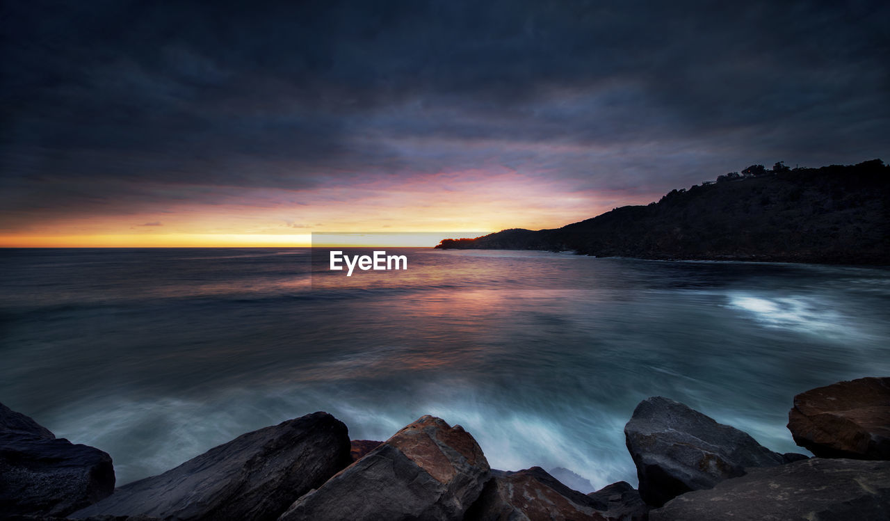 Scenic view of sea against sky during sunset