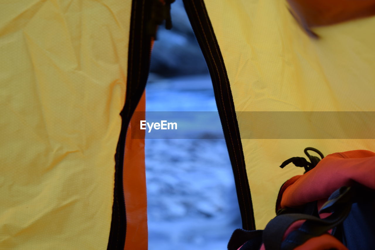 Field seen through tent entrance