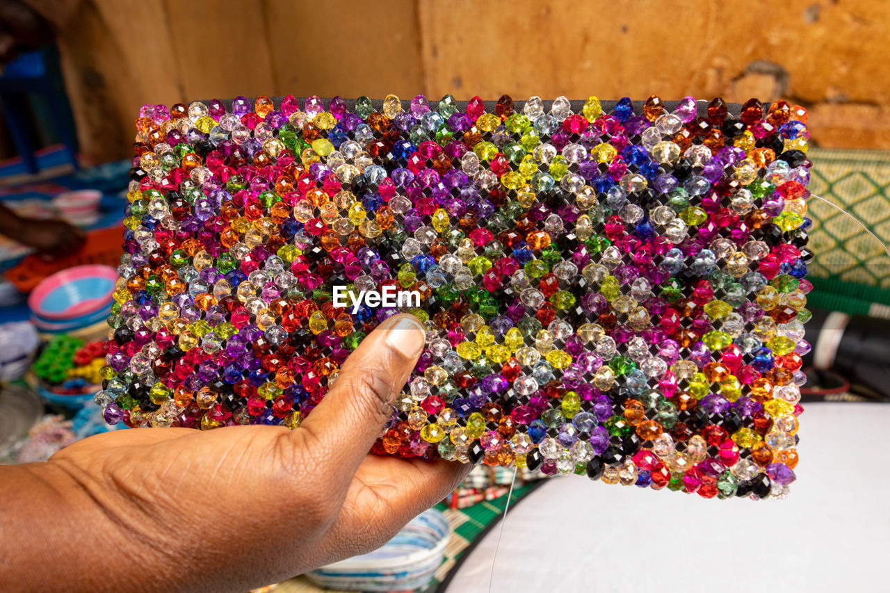 Cropped hand of woman holding a craft bag