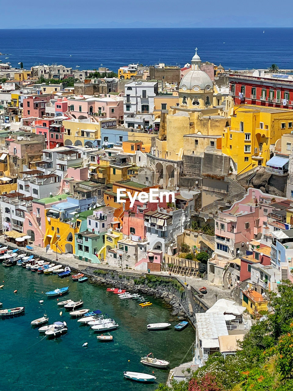 High angle view of procida by sea against sky