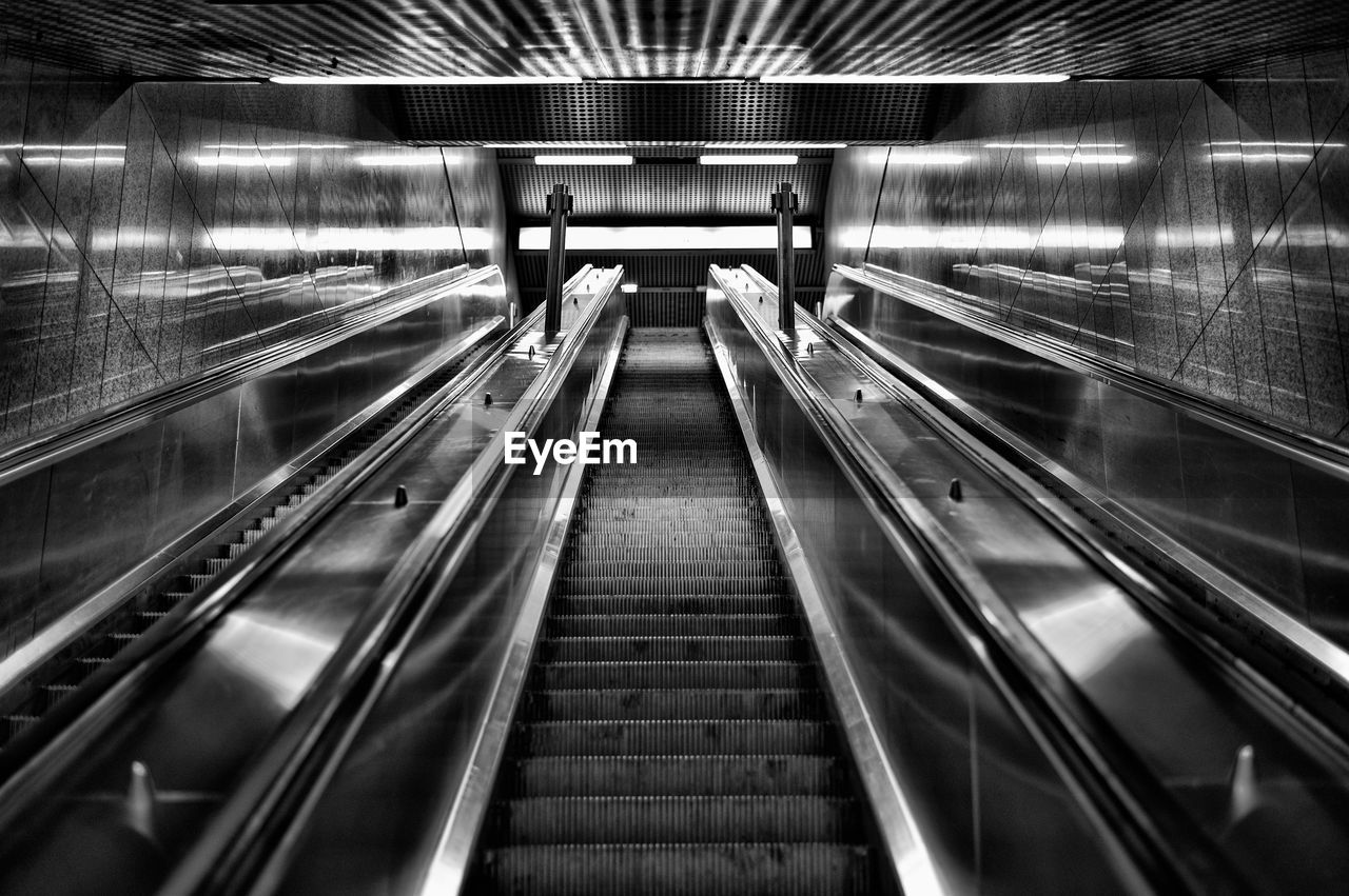 ESCALATOR IN ILLUMINATED UNDERGROUND WALKWAY