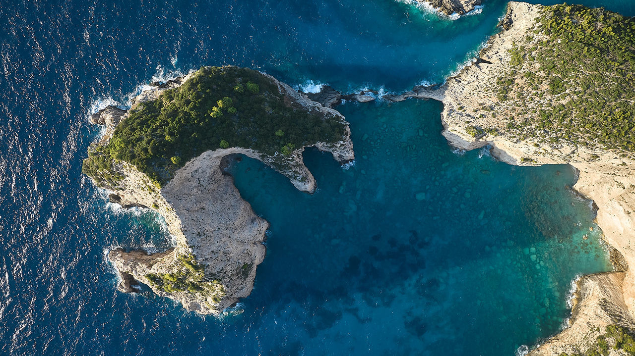 water, sea, aerial photography, land, nature, aerial view, map, coast, beach, no people, environment, island, terrain, high angle view, outdoors, beauty in nature, coastline, blue, ocean, scenics - nature, travel destinations, travel, landscape, day, archipelago, islet, panoramic, earth, tourism