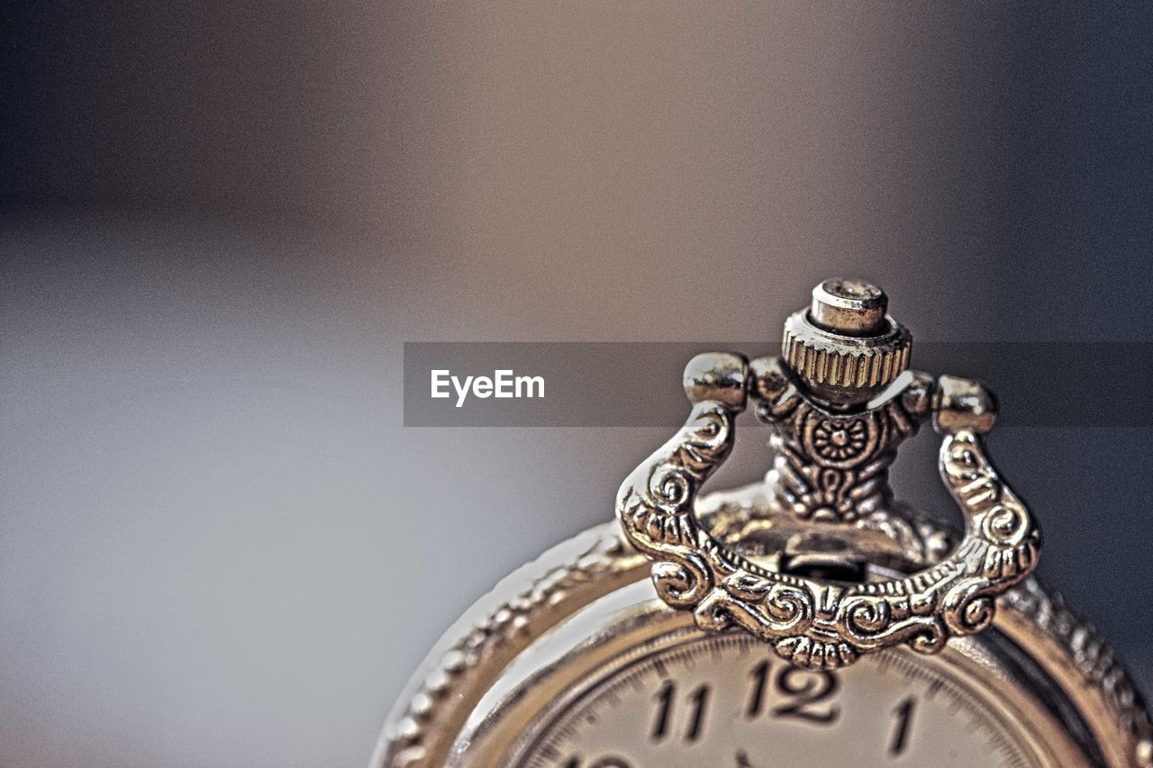 High angle view of 0ld pocket watch on table