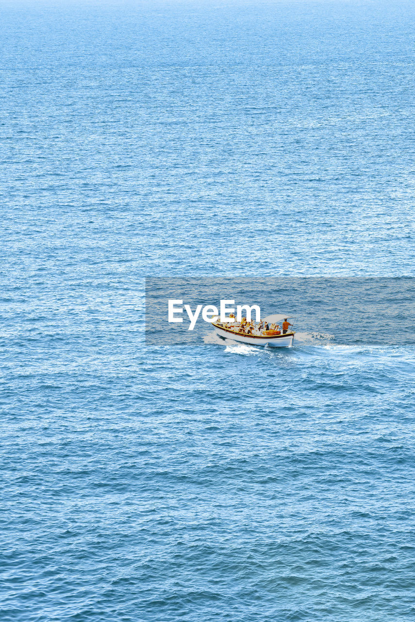 High angle view of boat sailing in sea