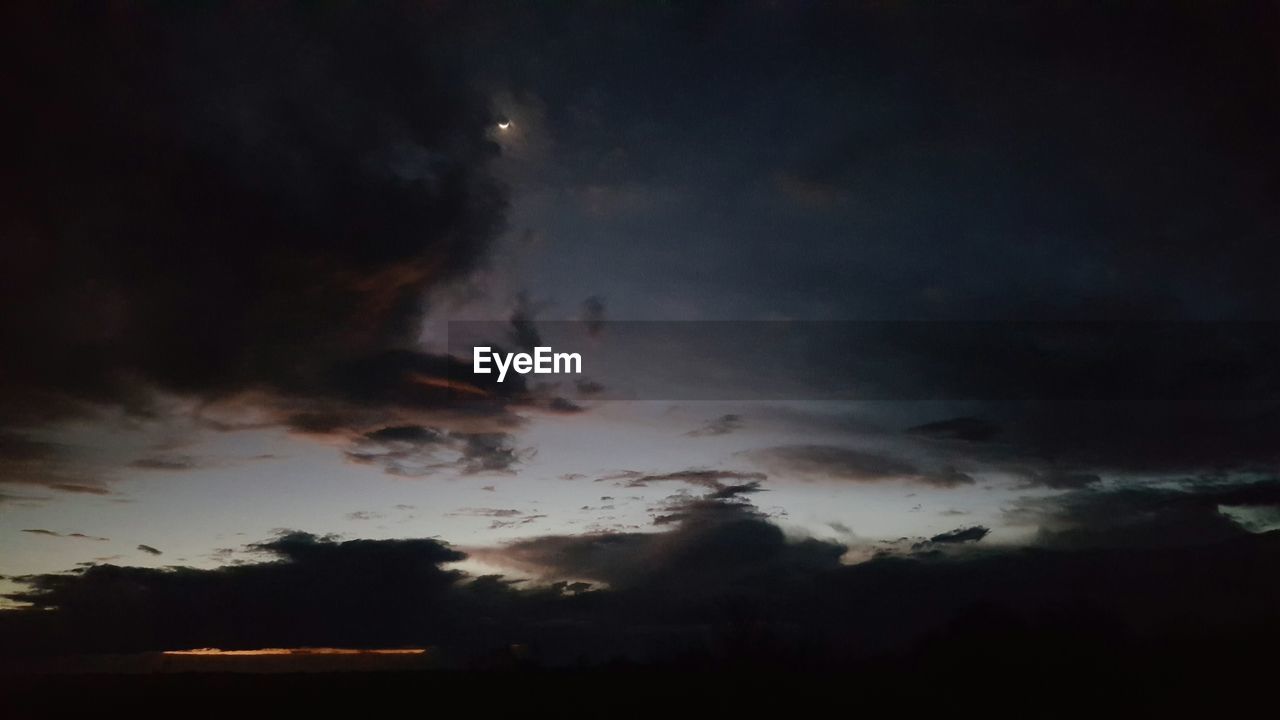 Low angle view of cloudy sky at dusk