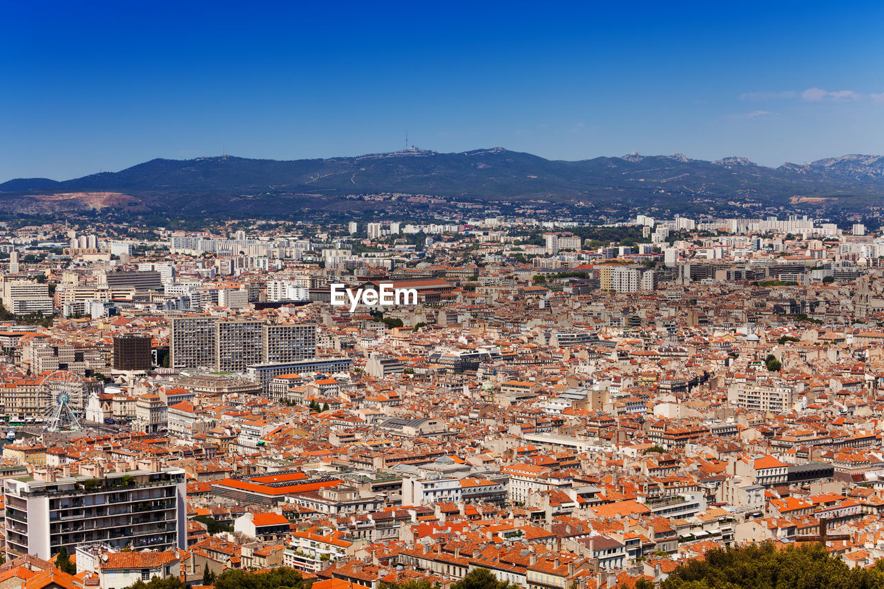 HIGH ANGLE SHOT OF TOWNSCAPE AGAINST CLEAR SKY