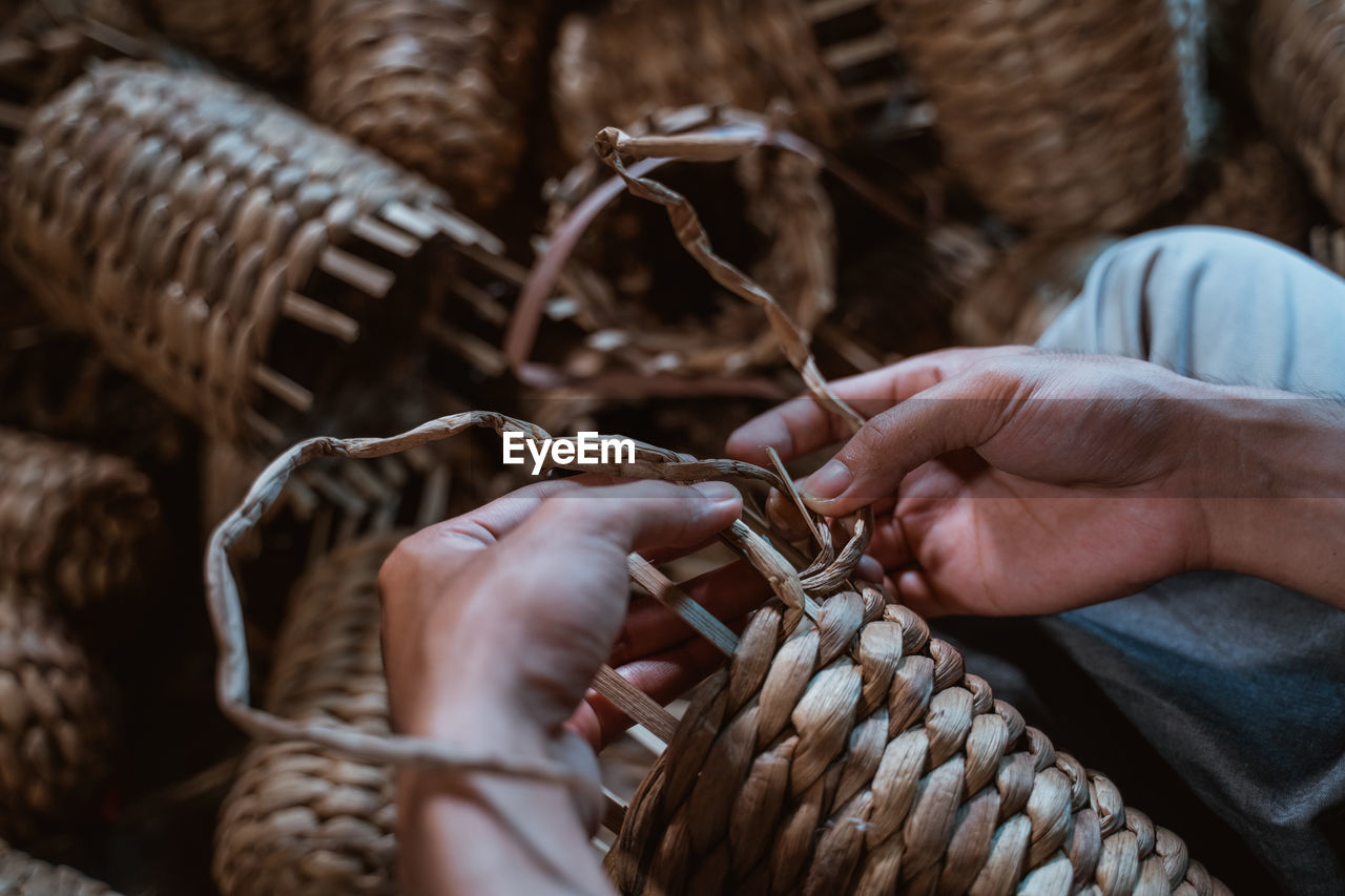 cropped hand of woman holding rope