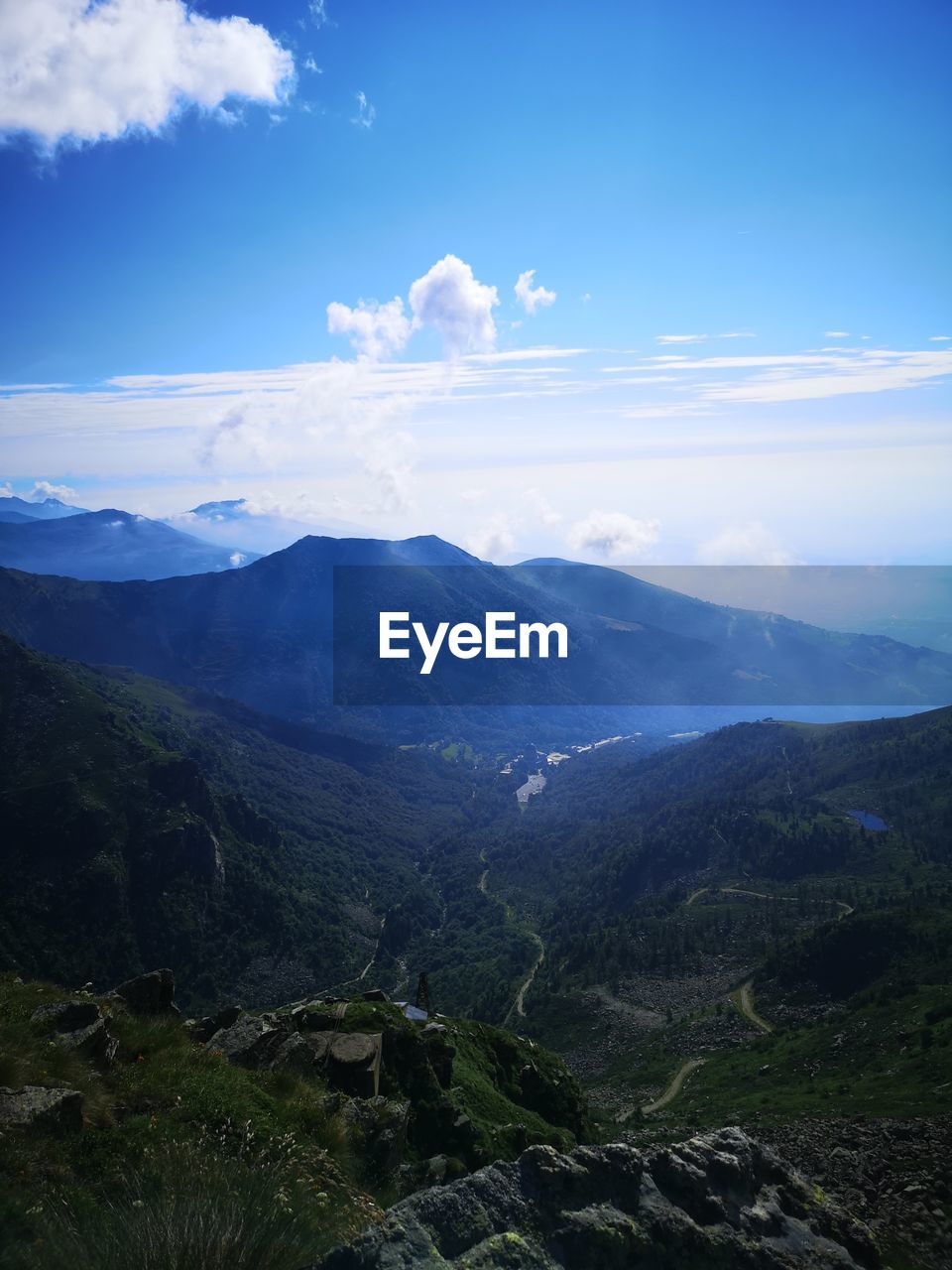 SCENIC VIEW OF LANDSCAPE AND MOUNTAINS AGAINST SKY