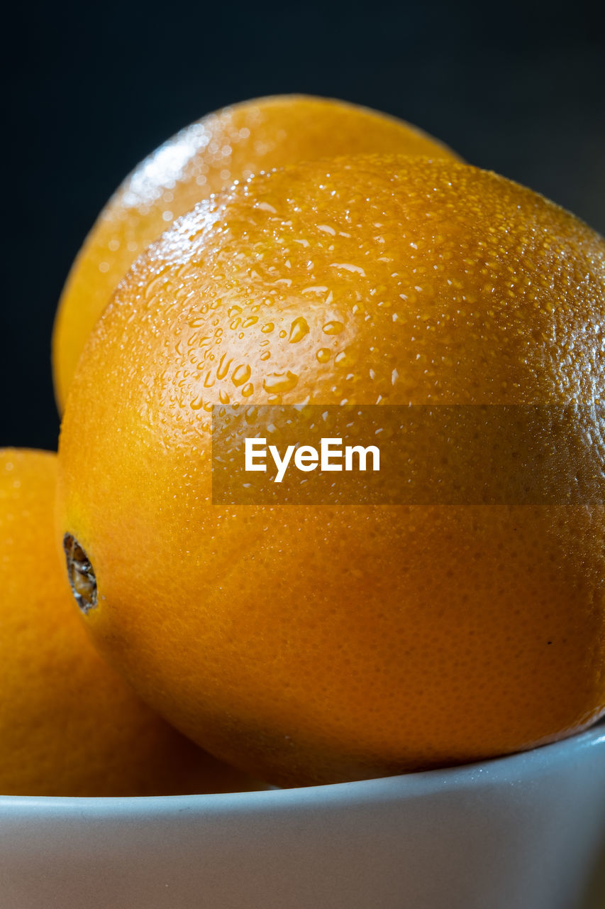 Helsinki / finland - closeup of moist and fresh oranges against studio background.