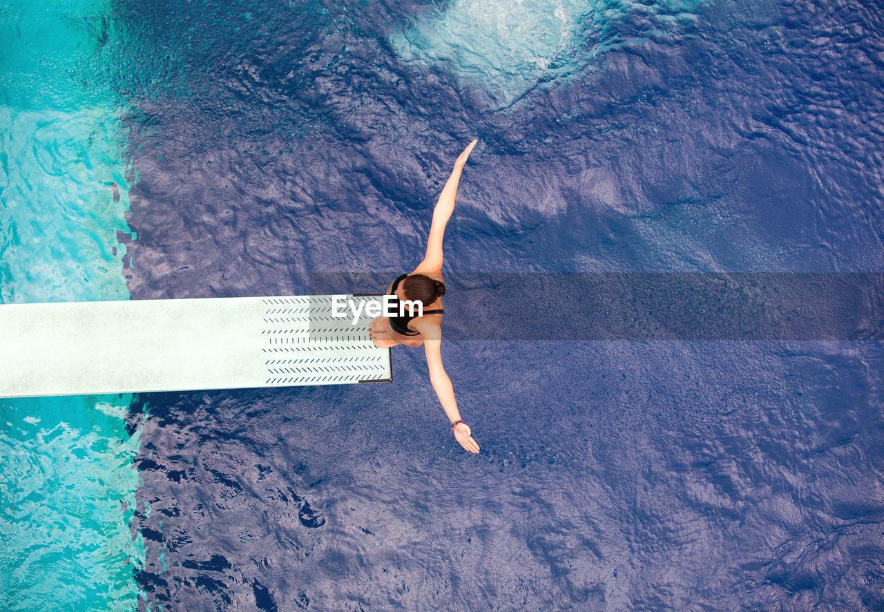 WOMAN SWIMMING IN POOL