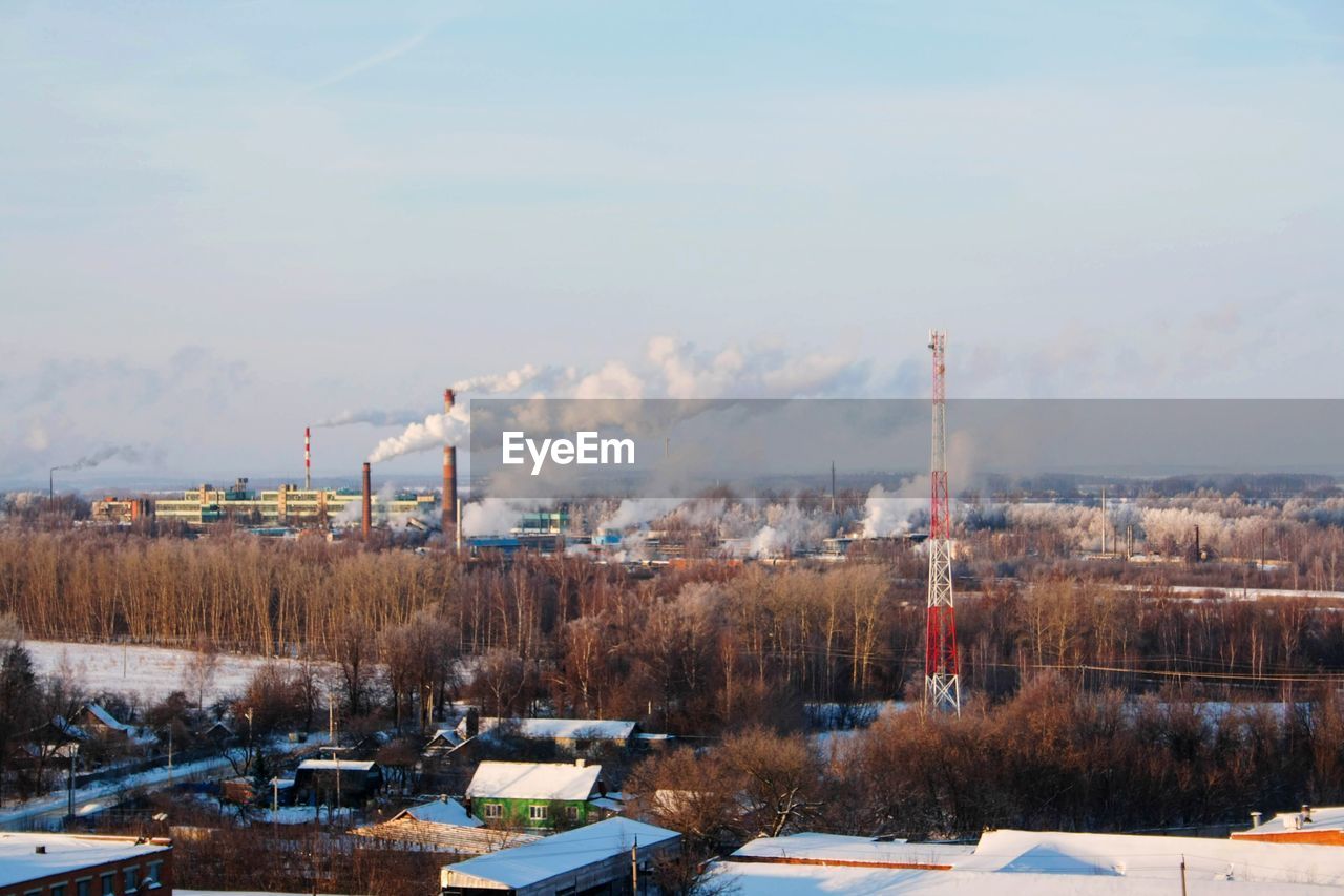 Panoramic view of factory against sky