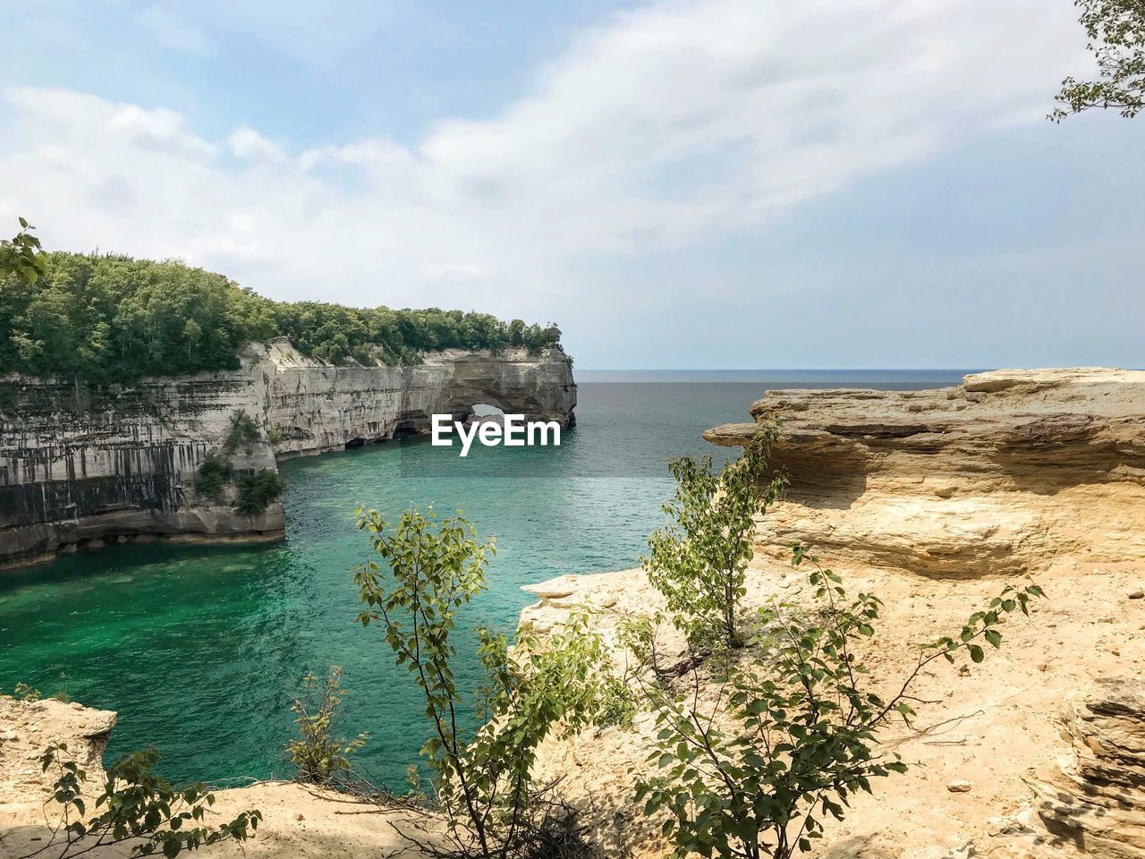 Scenic view of bay against sky