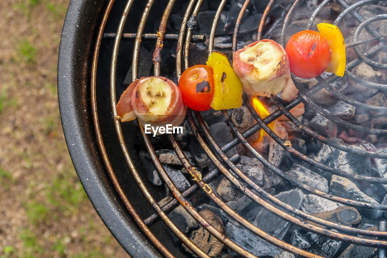 High angle view of meat on barbecue grill