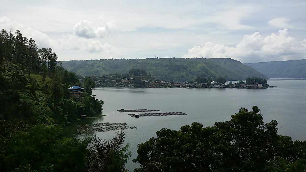 SCENIC VIEW OF LAKE WITH MOUNTAINS IN BACKGROUND