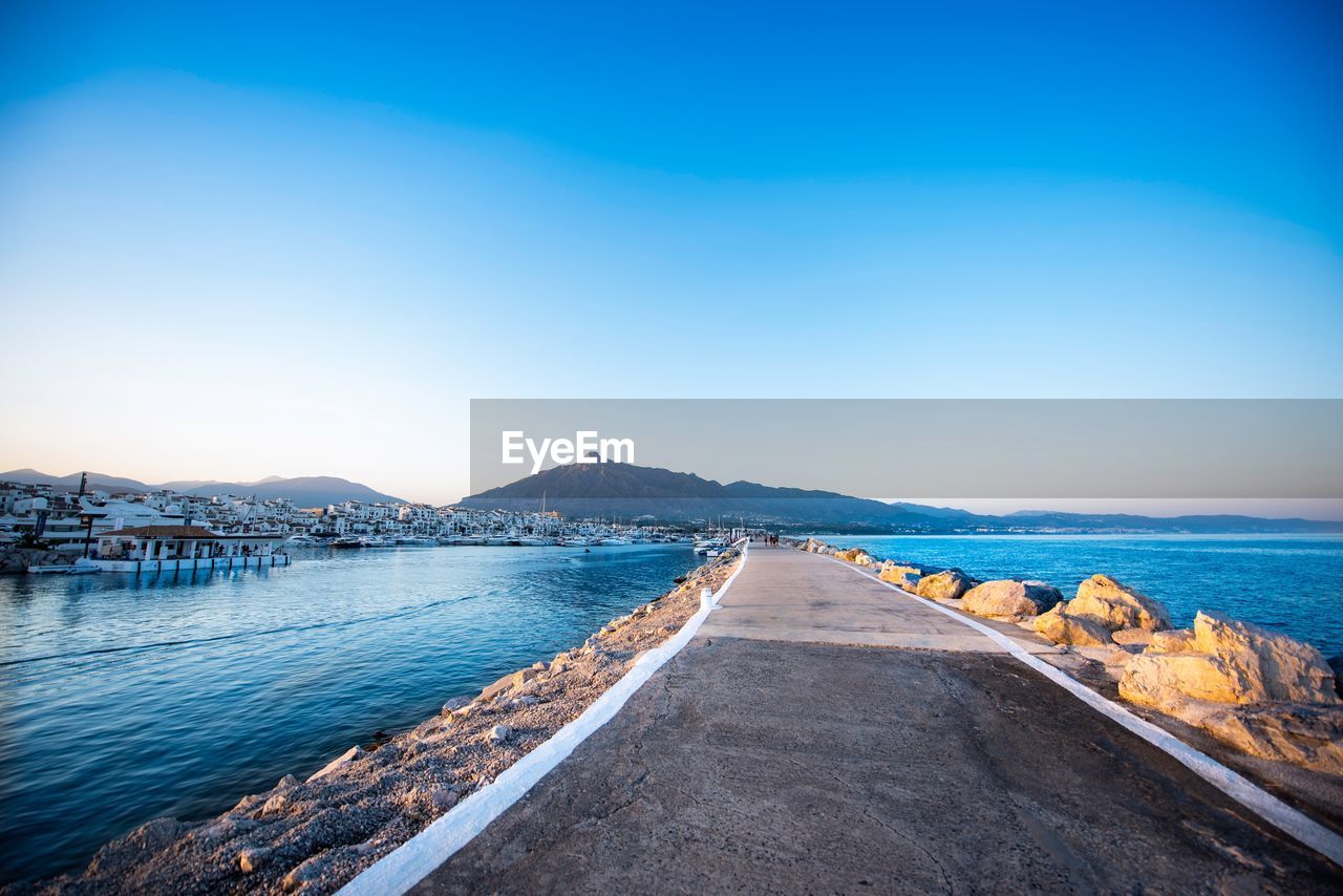Scenic view of sea against clear blue sky