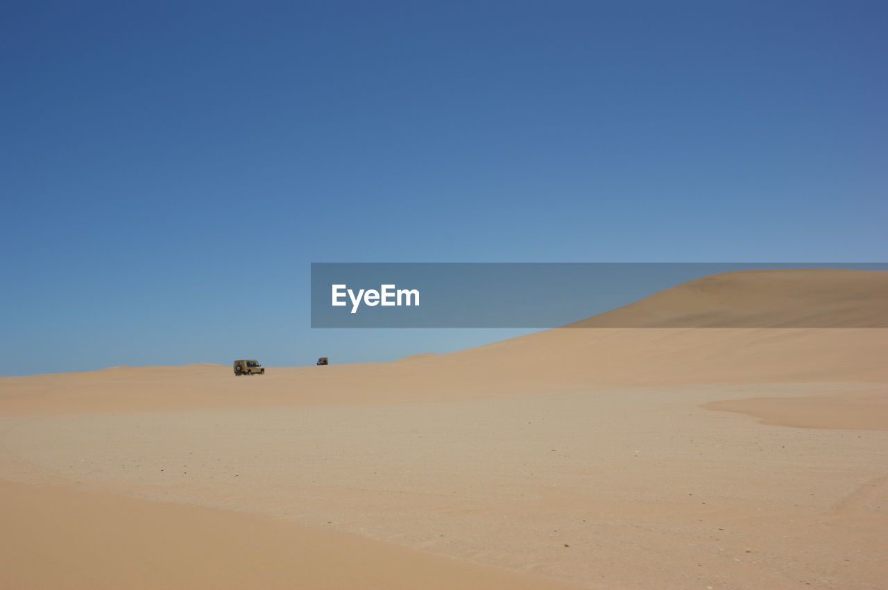 Distant cars in desert