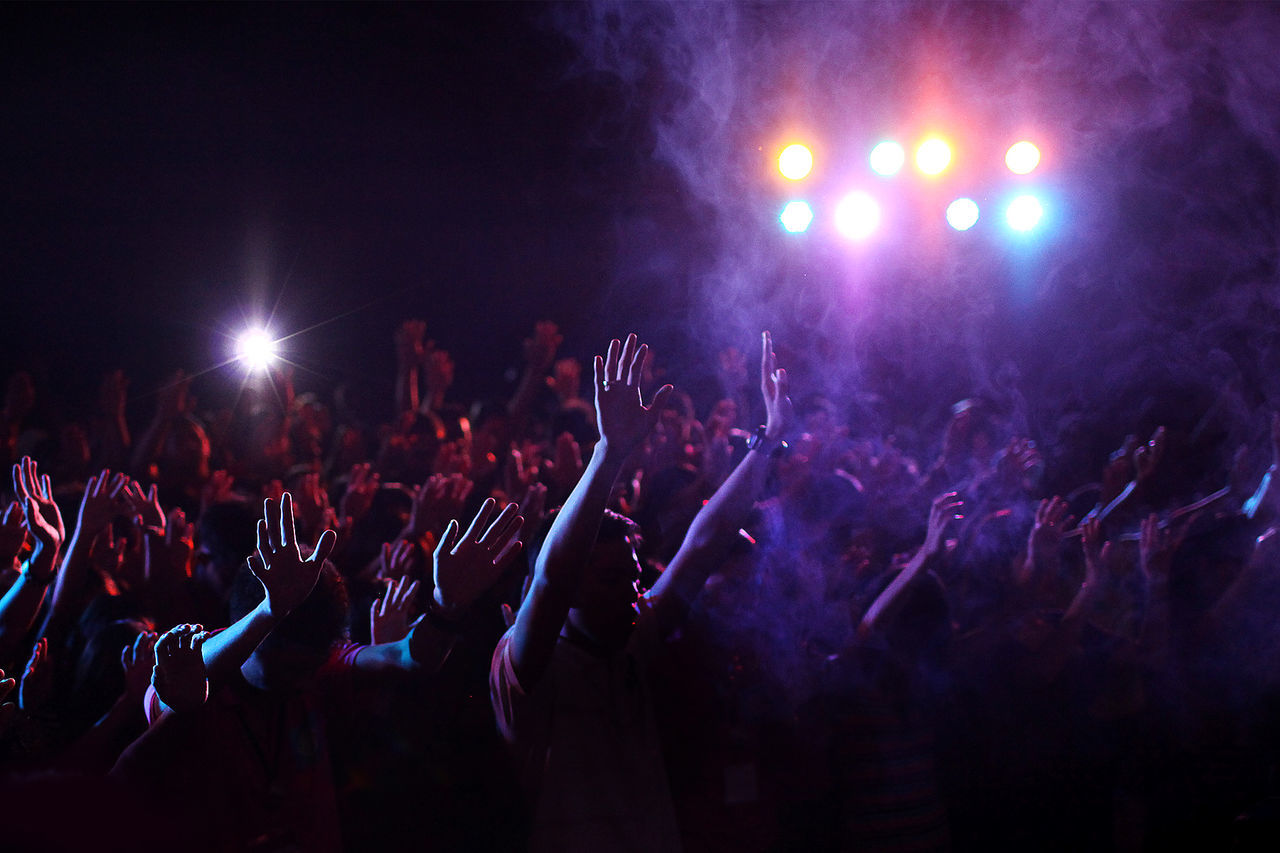 High angle view of audience at illuminated music concert