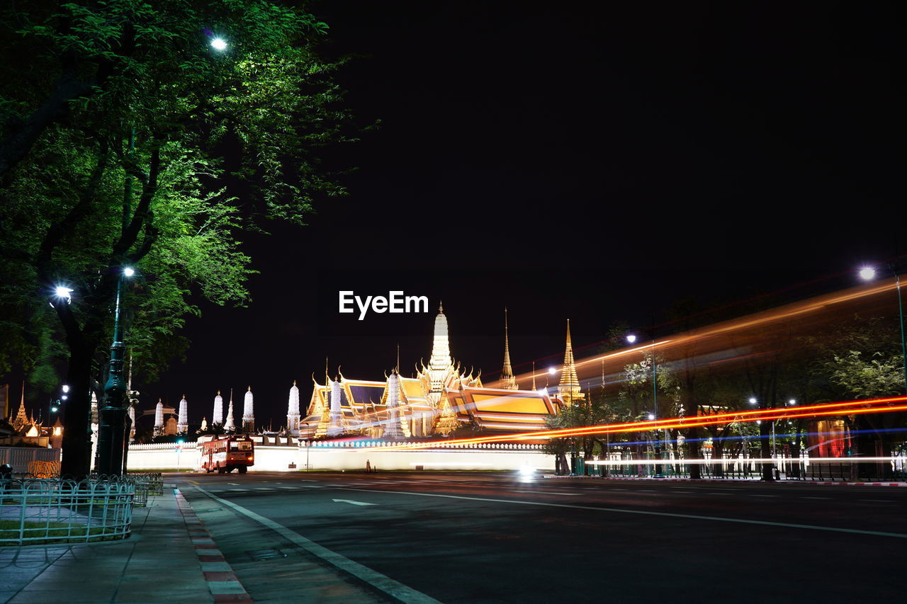 ILLUMINATED CITY STREET AT NIGHT