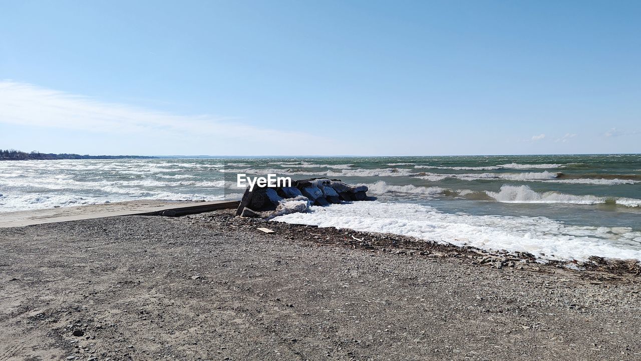 Scenic view of beach against clear sky