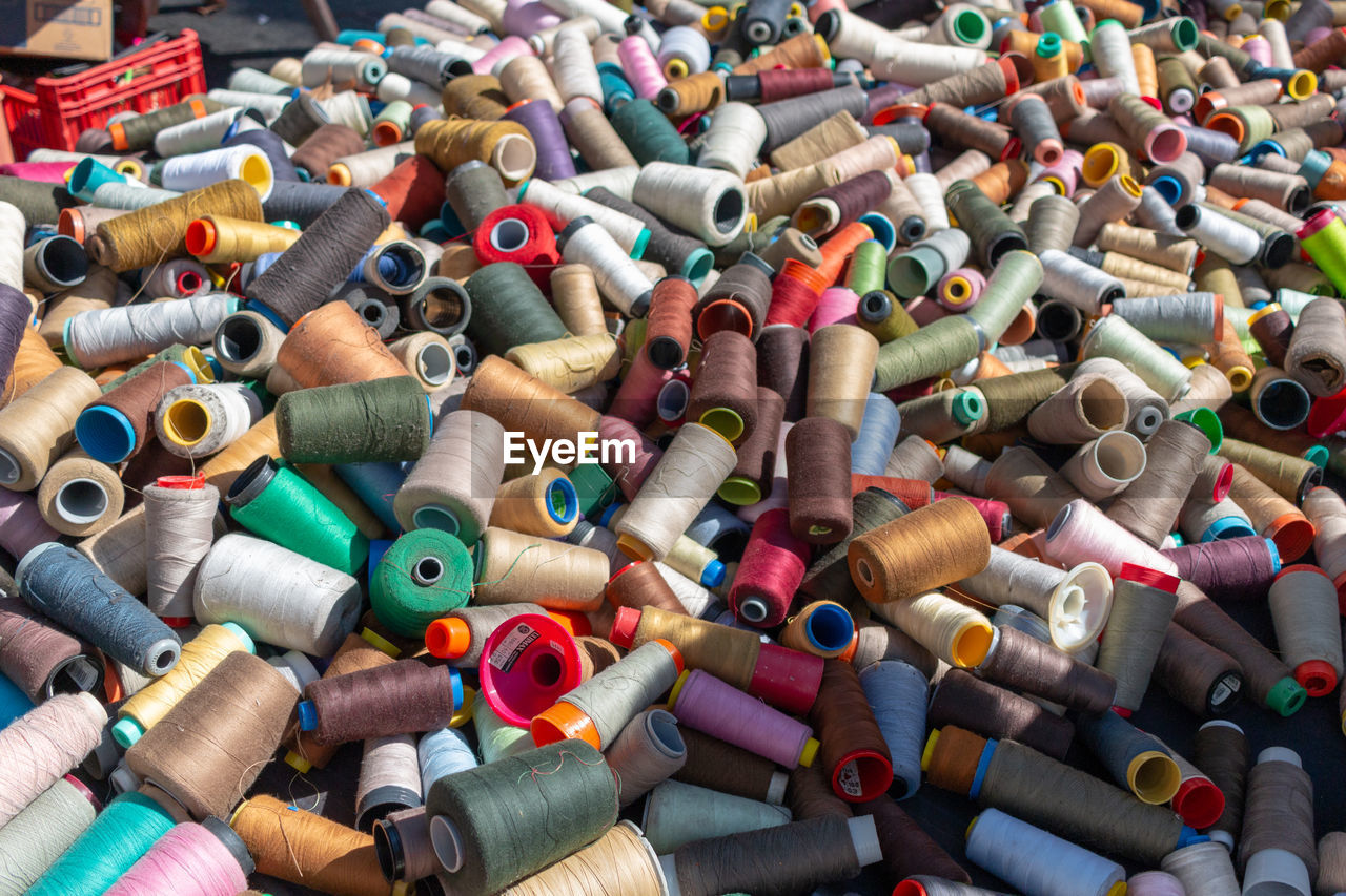 Multi colored spools at market stall for sale