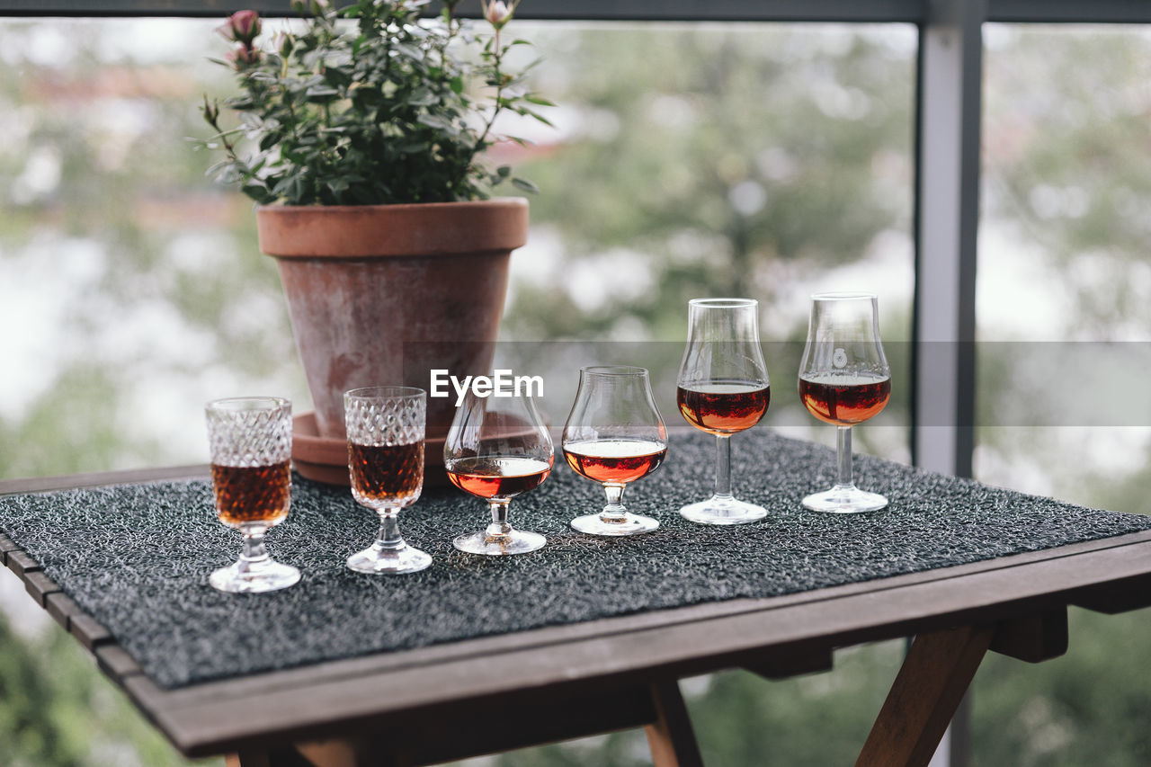 Close-up of alcoholic drinks in various glasses on table