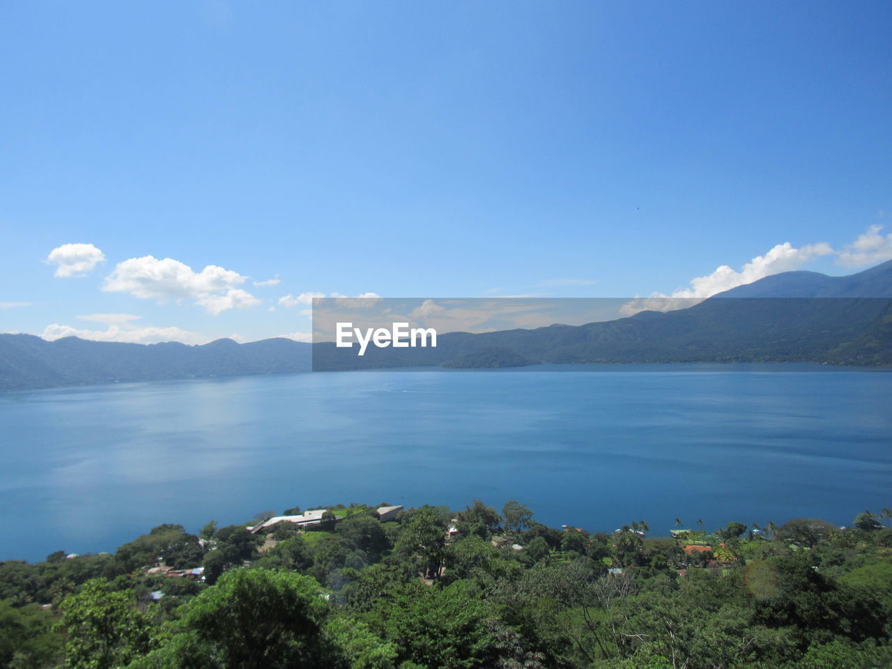 Scenic view of sea against blue sky