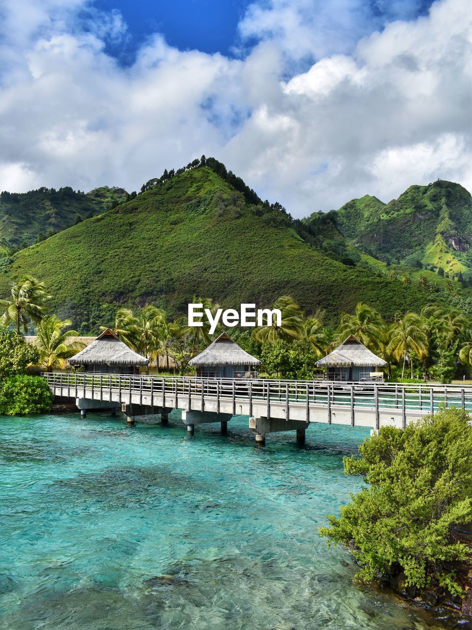 Scenic view of sea and buildings against sky