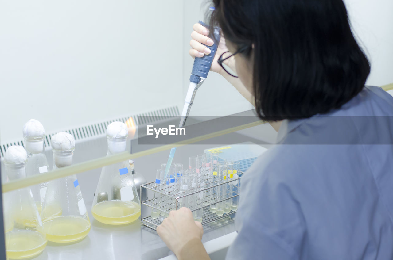 Scientist working at table in laboratory