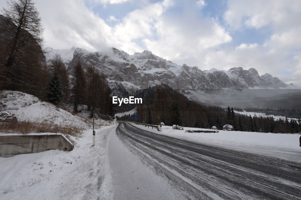 Scenic view of snow covered landscape against sky