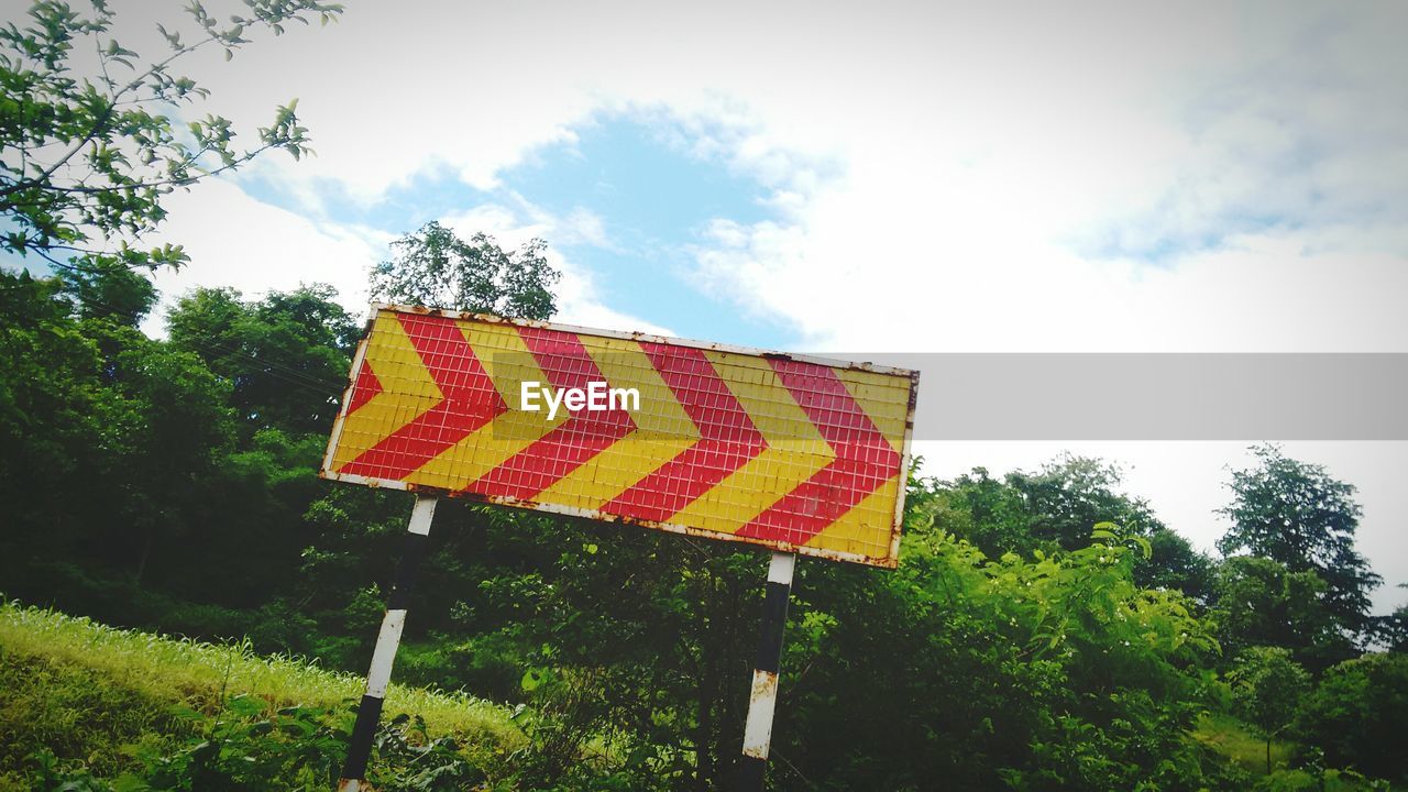 Low angle view of a road direction signal