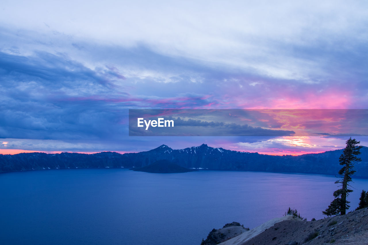 Scenic view of lake against sky during sunset