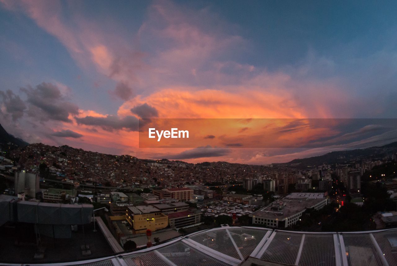 High angle view of cityscape against sky during sunset