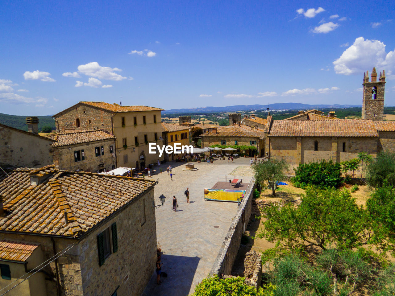 high angle view of buildings in town against sky