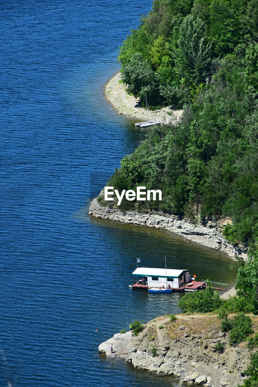 High angle view of boat in dnieper river by mountain