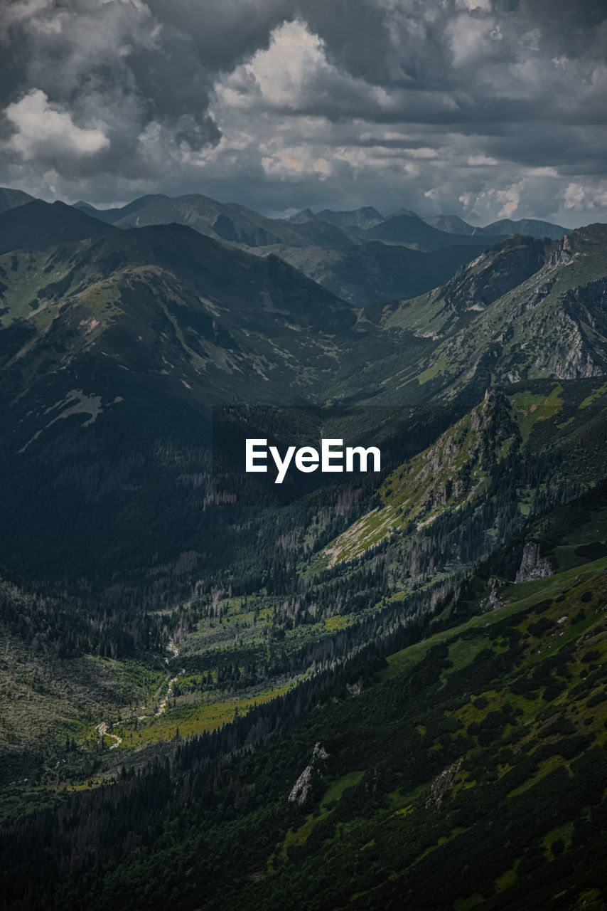 Aerial view of valley and mountains against sky