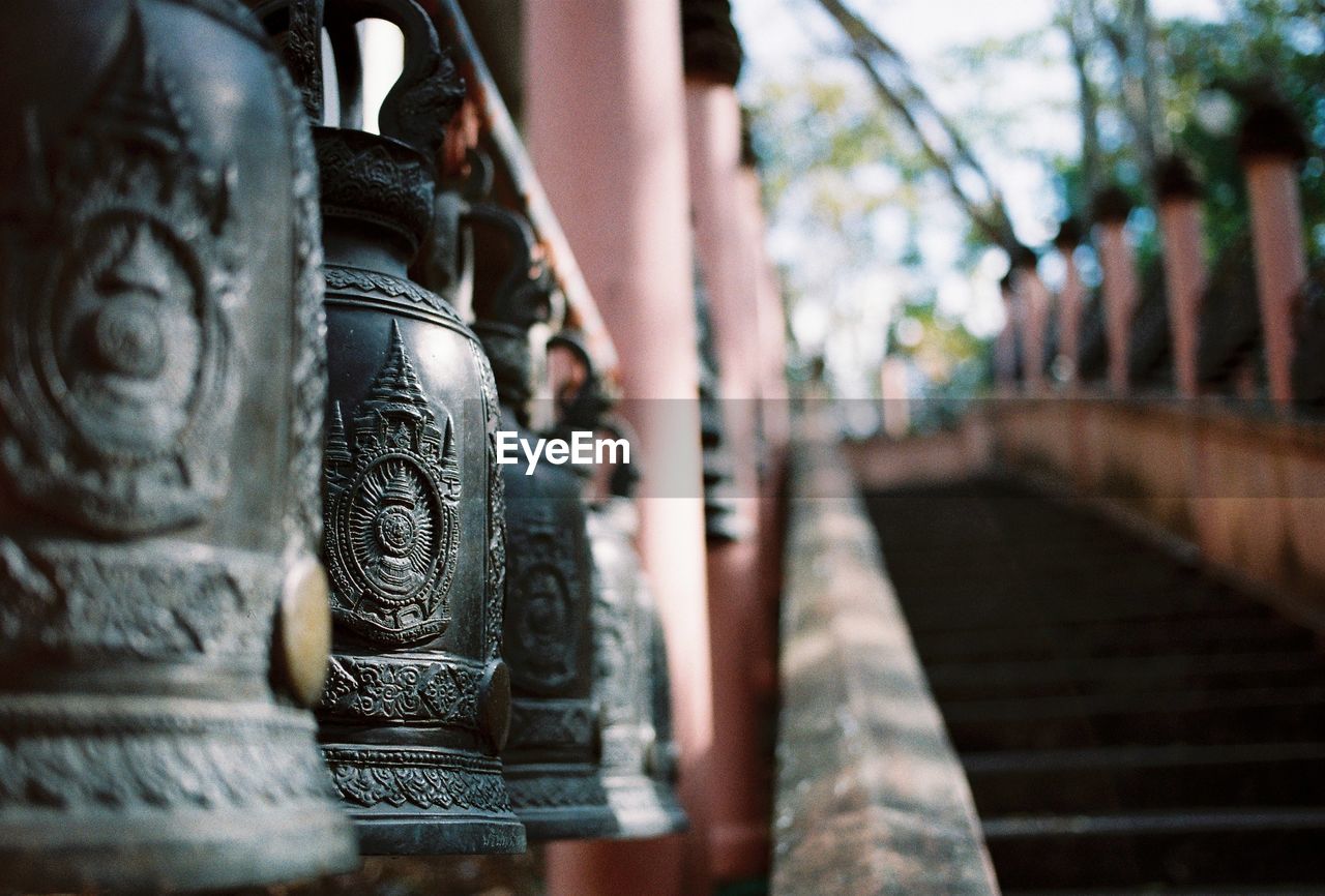 Close-up of bells hanging in temple